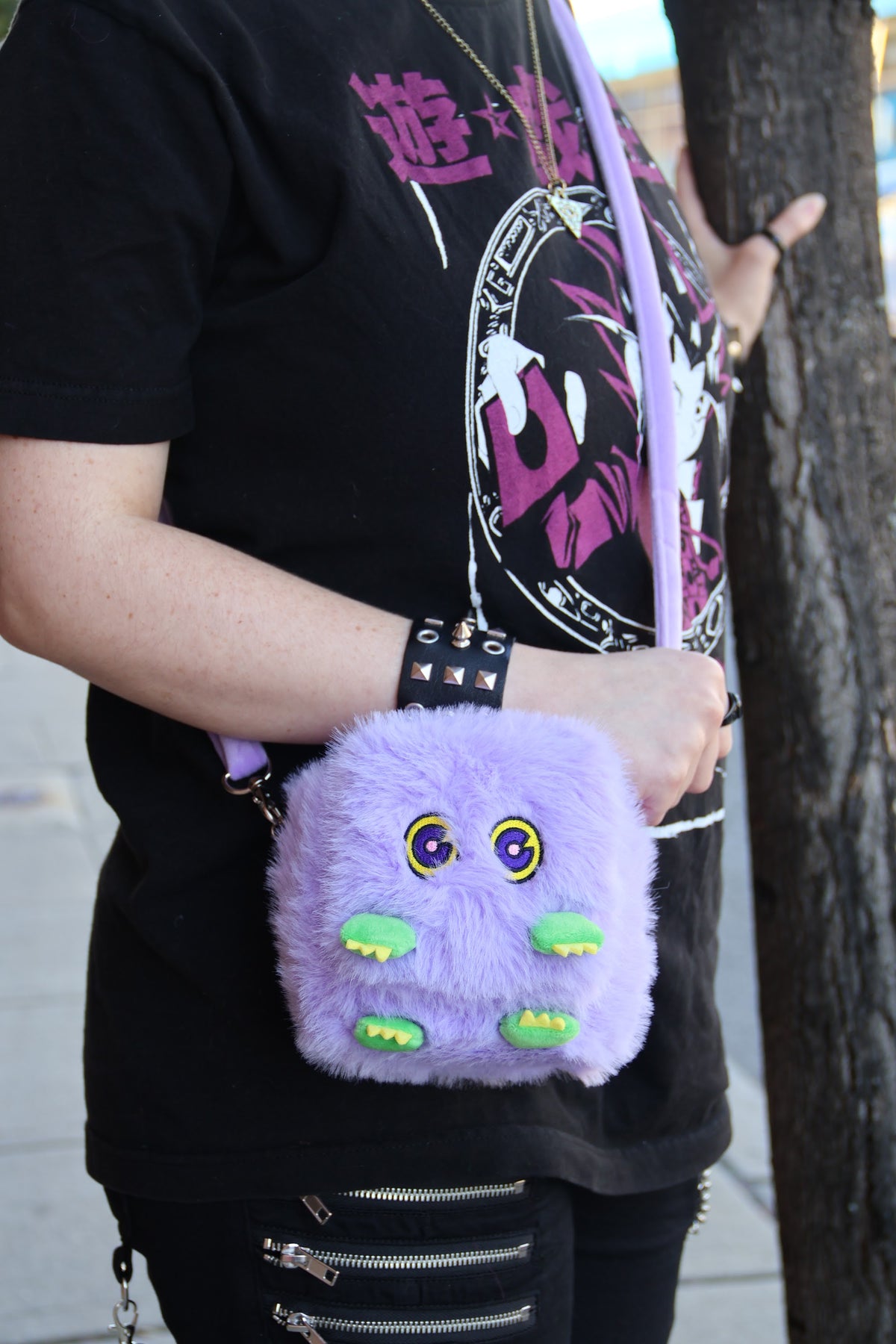 Kuribah plush deck box worn on a shoulder strap