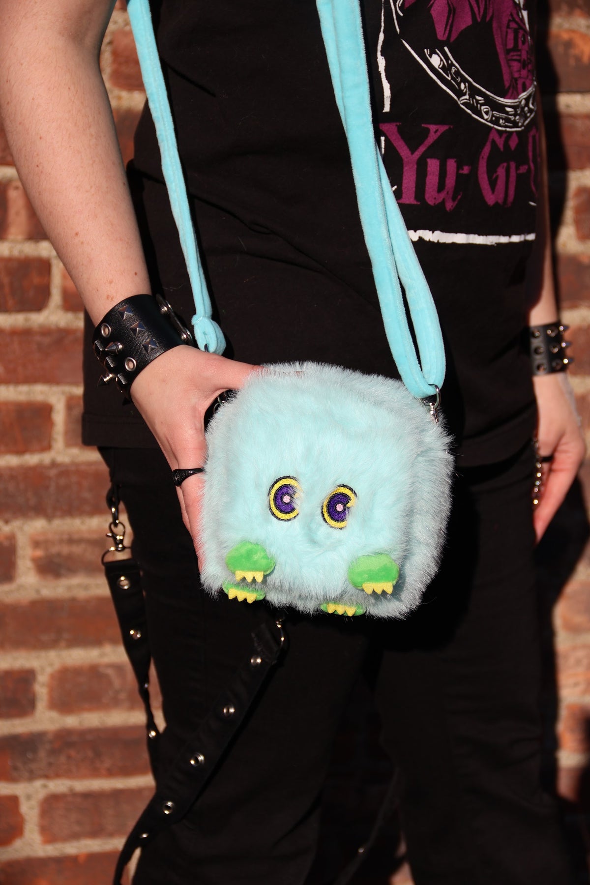 Kuribeh plush deck box worn on a shoulder strap