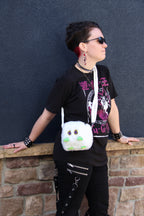 Kuriboo plush deck box worn on a shoulder strap