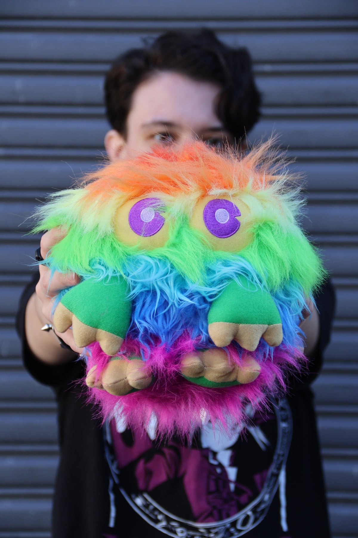 Rainbow Kuriboh 8 inch plush held up at Saga Concepts